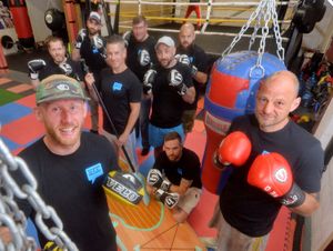 Supporting image for story: The gym where men learn to talk about their problems as well as to box