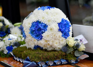 The funeral of sports broadcaster Nigel Pearson at St Benedict's Church, Wombourne..Flowers in the shape of a football in Albion colours