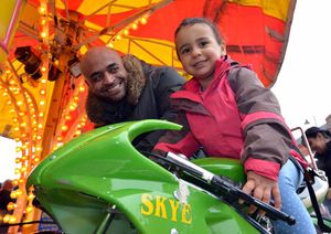Joe Hylton from Dudley enjoys the free fairground rides in Stone Square with his daughter, Lilly Hylton