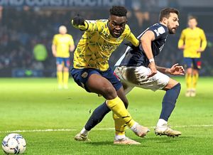 Daryl Dike gets past Yoann Barbet after coming off the bench for a 30-minute debut at Loftus Road on Saturday