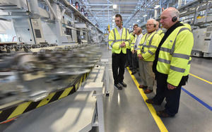 Pensioners from Cannock Chase Probus Club are given a guided tour by staff member Gareth Slater