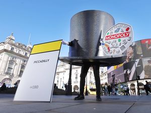 Supporting image for story: Giant Monopoly ‘top hat’ roams London’s streets to celebrate new 50p coins