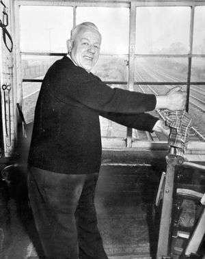 February 1, 1971. The caption reads: 'Signalman Mr Cecil Evans, of Pitchford Road, Albrighton, who retires on March 27 after 48 years on the railways. He has been at Cosford for 12 years. Before that he worked at Codsall for 13 years.' 