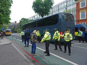 Supporting image for story: Three charged after protest stops coach taking asylum seekers to Bibby Stockholm