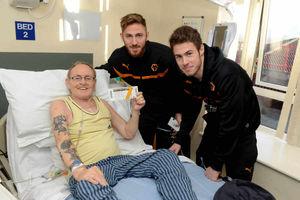 From left is Terry McKeown of Bushbury getting match tickets from James Henry and Tommy Rowe