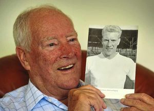 Flowers, who turned 82 this week, hold a photograph of himself from the 1960s