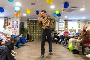 Elvis Presley impersonator Lee Grindey, performing at the birthday party.