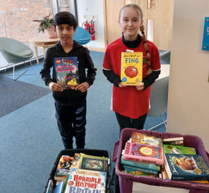 Pupils from Lightmoor Village Primary choosing their free pre-loved books, following their Reuse Competition win.