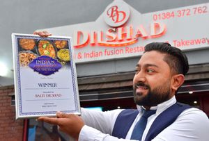 Balti Dilshad manager Malik Miah with the restaurant's Indian Restaurant of the Year award