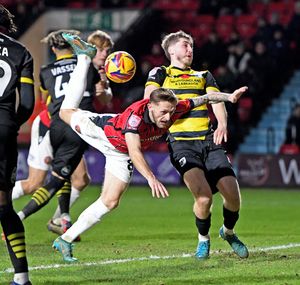 Charlie Lakin in action for Walsall in their clash with Barrow