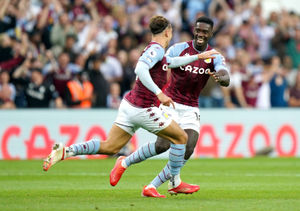 Aston Villa's Matty Cash (left) celebrates scoring