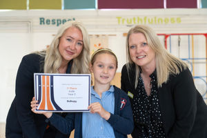 Olivia and Rachel with winner Indie, whose cat-themed design will be brought to life inside the fourth bedroom of the Lorimer showhome at Bellway’s Baldwins Gate Grange development.