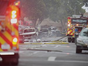 Supporting image for story: Small plane crashes into US neighbourhood setting homes and vehicles on fire