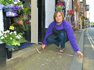 Supporting image for story: Florist ordered to remove blooms from Ludlow pavement