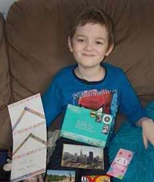 Josh with a collection of postcards sent from California