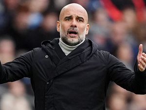 Manchester City manager Pep Guardiola gestures on the touchline