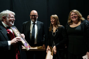 David Jones, chairman of Froncysyllte Male Voice Choir (left), presents Welsh lovespoons to Alice Pavarotti, daughter of Luciano Pavarotti and his wife, Nicoletta, and  Massimo Mezzetti, Mayor of Modena. Also pictured is Leigh Mason, the choir’s Musical Director