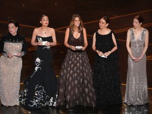 Supporting image for story: Bridesmaids cast reunite on Oscars stage and read out fake audience notes
