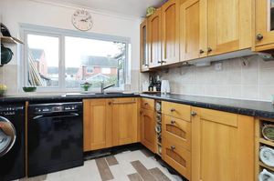 Modern fitted kitchen overlooking the rear garden