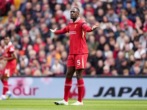 Liverpool’s Ibrahima Konate stretches his arms out wide