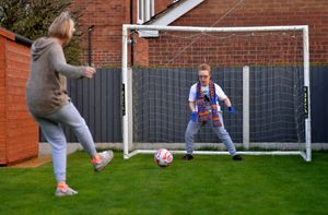 Football-mad Christian Peacock, 15, with mother Katie