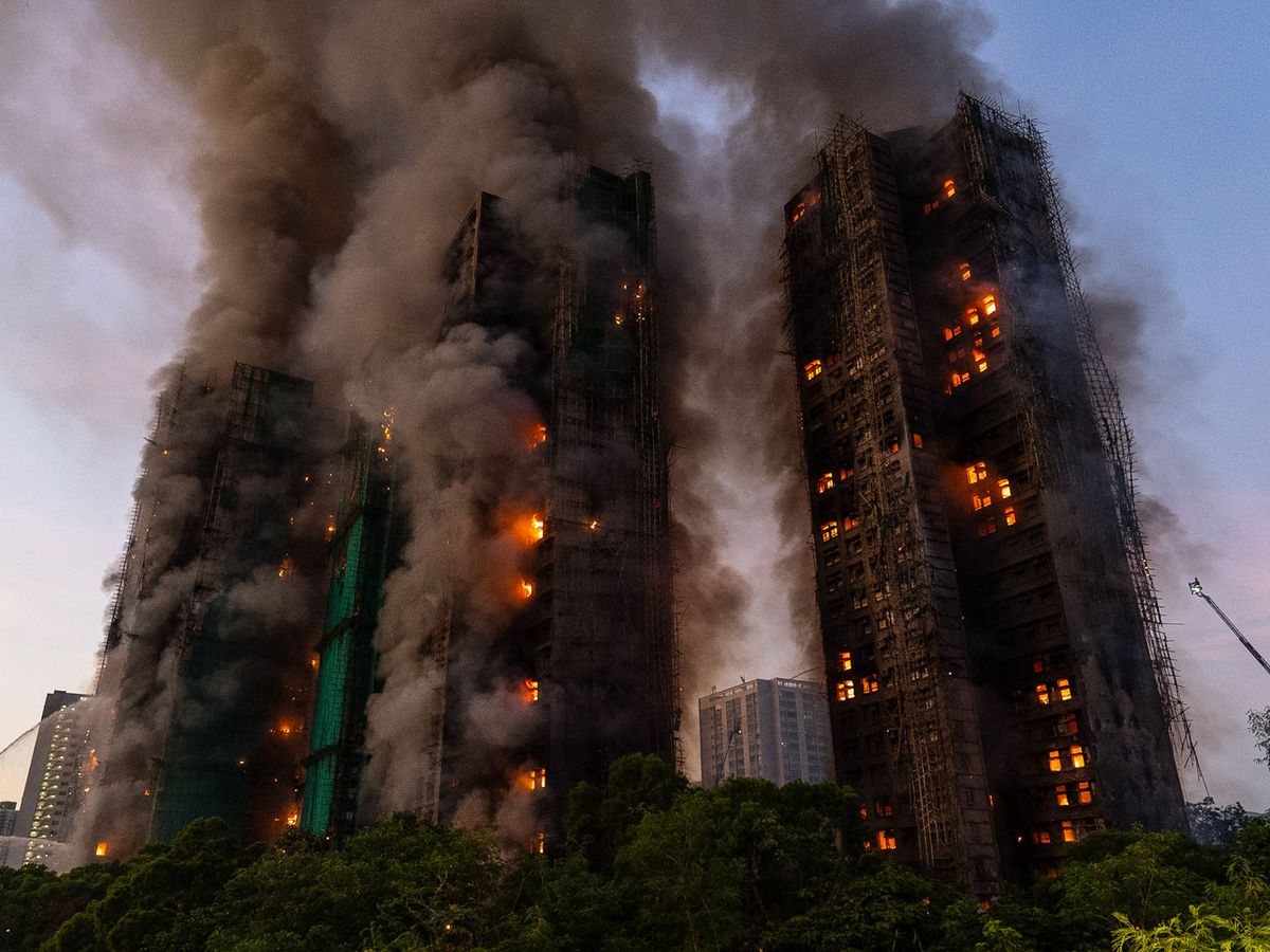 Four dead as fire rages through Hong Kong high-rise residential complex