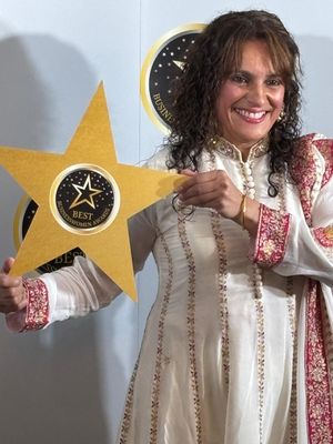 Julie with the Best Businesswomen's award for Best Consumer Business 2024