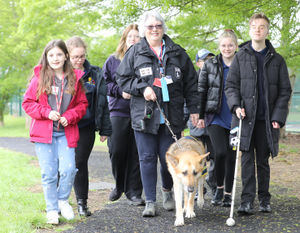 Pictured is Archie the guide dog with David Underwood (Guide Dogs) Olivia Bradshaw (Guide Dog volunteer) Miss Rosie Hatton (Assistant Head Teacher) and students from the school