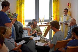 Friends and family gather for the poignant service.