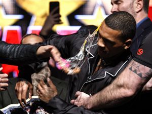 Chris Eubank Jr strikes Conor Benn with an egg during a press conference at Manchester Central.