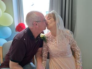 Supporting image for story: Hospital staff form guard of honour as terminally-ill colleague marries sweetheart of 40 years