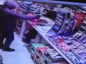 Supporting image for story: WATCH: Armed robber holds up shop at gun point during terrifying raid