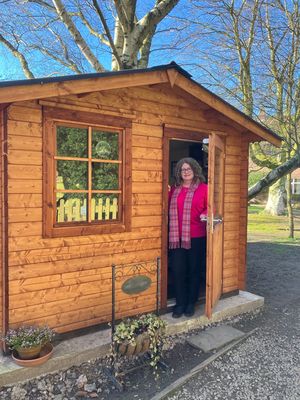 Vikki Brookes, who runs Values-Led Vas, in her new log cabin