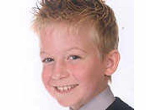 Supporting image for story: Mother keeps bedside vigil