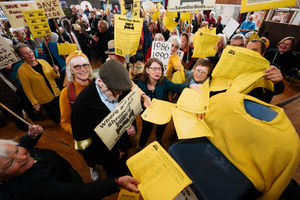The campaigners presented a petition to an empty chair after a Shropshire Community Health Trust meeting was moved away from the town when a decision on the plans was postponed.
