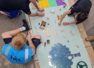 The hib. team created and installed a new sensory board for the playground. 