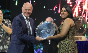 Soprano Shimona Rose, from Singapore, being presented with the Pendine Trophy by Mario Kreft MBE, from sponsors Pendine Park