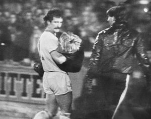 Graeme Souness carries an injured fan to safety after the near tragedy in 1984.