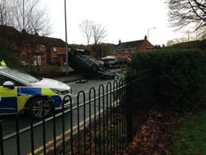 Supporting image for story: Man taken to hospital after flipping car onto roof in crash