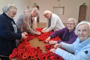 Tying the poppies on 