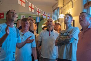 Fans stare in despair as the match clips away from England