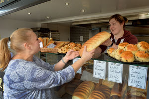 Leanne Nicholls at Matt the Bakers serves Tracy Oglvie at Wolverhampton Market