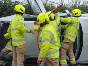 Fire crews work to cut the car open. Photo: Dudley Fire Station