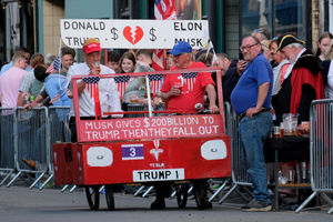 Donald Trump and Elon Musk put aside their differences to take part in the wheelbarrow race – played by Martin Bullock and David Lewis. Andy Compton image