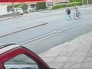 Supporting image for story: Caught on CCTV: Ride-by robber knocks woman, 68, to ground as her handbag is stolen