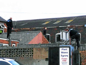 Supporting image for story: Wanted man seized in Tipton rooftop stand-off