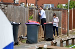 Detectives gathering evidence at the scene