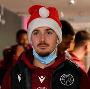 Walsall FC players visit Walsall Manor Hospital.Jamie Jellis dons a Santa hat for the occasion.
