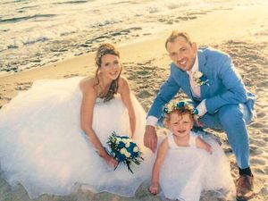 Katie, husband Richard and daughter Elsie at their Greek wedding