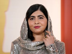 Supporting image for story: Malala Yousafzai arrives for Oscars draped in silver sequins